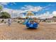 Playground with a spinner and shaded play area at 702 E Nancy Ave, San Tan Valley, AZ 85140