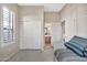 Well-lit bedroom with double doors leading to the bathroom at 8179 E Sierra Pinta Dr, Scottsdale, AZ 85255