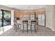 Modern kitchen with ample cabinetry and a breakfast bar at 8179 E Sierra Pinta Dr, Scottsdale, AZ 85255