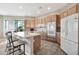 Modern kitchen with light wood cabinets, stainless steel appliances, and an island at 8179 E Sierra Pinta Dr, Scottsdale, AZ 85255