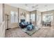 Cozy living room featuring a fireplace and plenty of natural light at 8179 E Sierra Pinta Dr, Scottsdale, AZ 85255