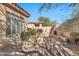 Relaxing backyard patio with built-in barbecue and fireplace at 8179 E Sierra Pinta Dr, Scottsdale, AZ 85255