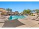 Community pool with lounge chairs and shaded seating areas at 8179 E Sierra Pinta Dr, Scottsdale, AZ 85255