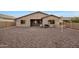 Backyard view of house and gravel area at 10051 S 184Th Dr, Goodyear, AZ 85338