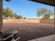 Large backyard with gravel and a grill at 10051 S 184Th Dr, Goodyear, AZ 85338