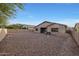 Backyard with gravel, and partial house view at 10051 S 184Th Dr, Goodyear, AZ 85338