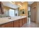 Double vanity bathroom with updated fixtures and a large mirror at 10051 S 184Th Dr, Goodyear, AZ 85338