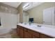 Bathroom with double vanity, shower, and tub at 10051 S 184Th Dr, Goodyear, AZ 85338