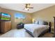 Relaxing bedroom includes a large window, ceiling fan and plenty of natural light at 10051 S 184Th Dr, Goodyear, AZ 85338