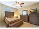 Cozy bedroom with a comfortable bed and plenty of natural light at 10051 S 184Th Dr, Goodyear, AZ 85338