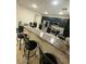 Kitchen island with seating for four and granite countertop at 12525 W Winslow Ave, Avondale, AZ 85323