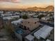 Two-story house with a pool and mountain views in the background at 13032 N 19Th St, Phoenix, AZ 85022