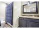 Bathroom with granite countertop vanity and a shower/tub combo at 13032 N 19Th St, Phoenix, AZ 85022