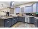 Modern kitchen with stainless steel appliances and granite countertops at 13032 N 19Th St, Phoenix, AZ 85022