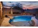 Luxury pool with waterfall feature at sunset at 13032 N 19Th St, Phoenix, AZ 85022