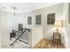 Upper landing with wood floors, a chandelier, and a small side table at 13032 N 19Th St, Phoenix, AZ 85022