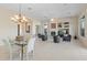 Elegant dining room with a glass table and chandelier at 1646 W Laurel Greens Dr, Phoenix, AZ 85086