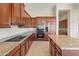 Well-equipped kitchen with granite island and stainless steel appliances at 1646 W Laurel Greens Dr, Phoenix, AZ 85086