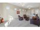 Relaxing sitting area with leather chairs and ample natural light at 1646 W Laurel Greens Dr, Phoenix, AZ 85086