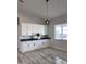 Modern kitchen featuring white shaker cabinets and dark countertops at 22538 W Pecan Rd, Buckeye, AZ 85326