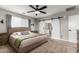 Main bedroom with barn door and ensuite bathroom at 24758 W Huntington Dr, Buckeye, AZ 85326