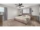 Main bedroom with a large bed and ceiling fan at 24758 W Huntington Dr, Buckeye, AZ 85326