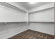 Large walk-in closet with double hanging rods at 24758 W Huntington Dr, Buckeye, AZ 85326