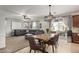 Open dining area with a wooden table and chairs, adjacent to the kitchen at 24758 W Huntington Dr, Buckeye, AZ 85326