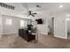 Bright loft bedroom with a desk and couch at 24758 W Huntington Dr, Buckeye, AZ 85326