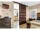 Bathroom with barn door and updated vanity at 2524 N Sunaire --, Mesa, AZ 85215