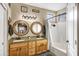 Bathroom with double sinks, granite countertop, and large mirrors at 2524 N Sunaire --, Mesa, AZ 85215