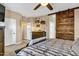 Bright bedroom with sliding barn door and wood furniture at 2524 N Sunaire --, Mesa, AZ 85215