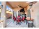 Covered patio with seating area, TV, and mini fridge at 2524 N Sunaire --, Mesa, AZ 85215