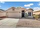 Single-story house with a two-car garage and desert landscaping at 2524 N Sunaire --, Mesa, AZ 85215