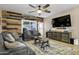 Relaxing living room with wood accent wall and plenty of natural light at 2524 N Sunaire --, Mesa, AZ 85215