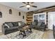 Cozy living room featuring a rustic wood feature wall and comfy seating at 2524 N Sunaire --, Mesa, AZ 85215