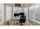 Bright home office with built-in window seat and plantation shutters at 2524 N Sunaire --, Mesa, AZ 85215