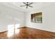 Bright bedroom featuring hardwood floors and large window at 2549 E Cherrywood Pl, Chandler, AZ 85249