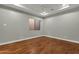 Bright bedroom with hardwood floors and ceiling fan at 2549 E Cherrywood Pl, Chandler, AZ 85249