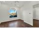 Bedroom with hardwood floors and large window with backyard view at 2549 E Cherrywood Pl, Chandler, AZ 85249