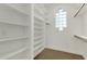 Spacious walk-in closet with ample shelving and hanging space at 2549 E Cherrywood Pl, Chandler, AZ 85249