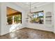 Bright dining room with large windows, chandelier, and tile floor at 2549 E Cherrywood Pl, Chandler, AZ 85249