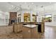 Large kitchen with a curved island, granite countertops and stone fireplace at 2549 E Cherrywood Pl, Chandler, AZ 85249