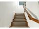 Elegant staircase with wood railing and carpet runner at 2549 E Cherrywood Pl, Chandler, AZ 85249