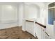 Upstairs hallway featuring a staircase and tiled floors at 2549 E Cherrywood Pl, Chandler, AZ 85249