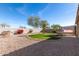 Backyard with grass, gravel, and a hammock at 27227 N 171St Dr, Surprise, AZ 85387