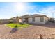 Landscaped backyard with gravel and a hammock at 27227 N 171St Dr, Surprise, AZ 85387