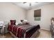 Spacious bedroom with a king-size bed and window coverings at 27227 N 171St Dr, Surprise, AZ 85387