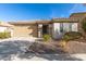 House exterior with a two-car garage and drought-tolerant landscaping at 27227 N 171St Dr, Surprise, AZ 85387