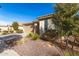 House exterior with desert landscaping and a two-car garage at 27227 N 171St Dr, Surprise, AZ 85387